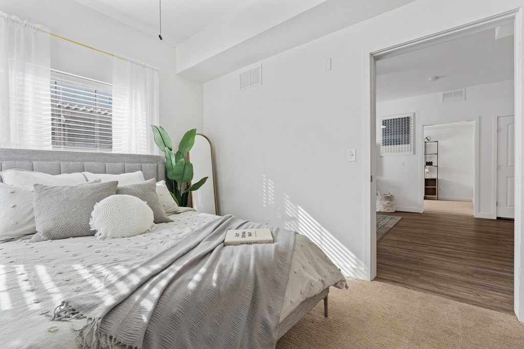 a bedroom with a bed and a large windowat The View on 20th, Ogden, UT