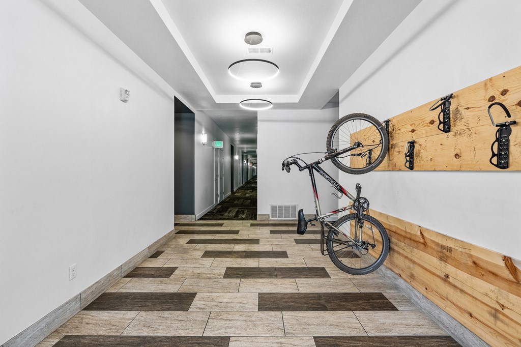 a bike hanging on a wall in a hallway with a wood wallat The View on 20th, Ogden