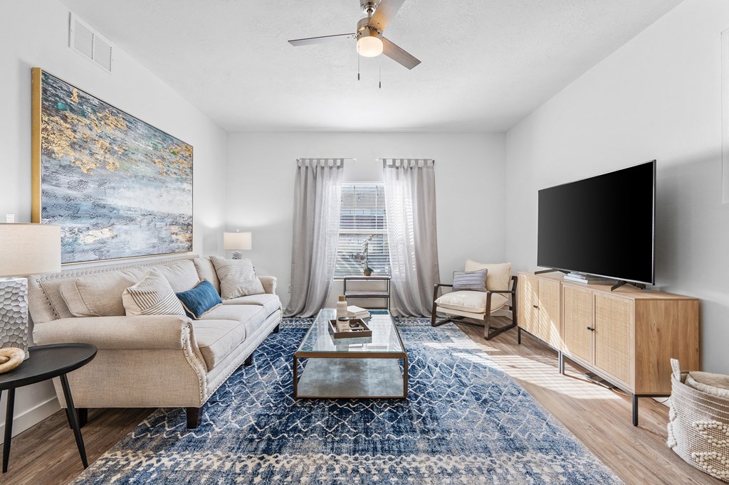 a living room with a couch and a tvat The View on 20th, Ogden, Utah