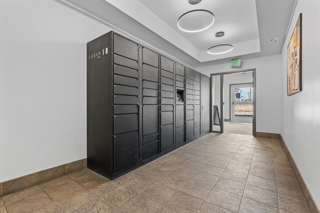 a long hallway with black lockers and a corridor with a doorat The View on 20th, Ogden, UT, 84401