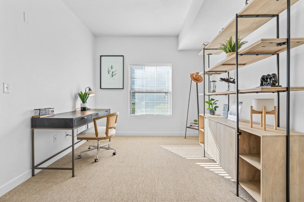 a home office with a desk and shelves and a windowat The View on 20th, Utah