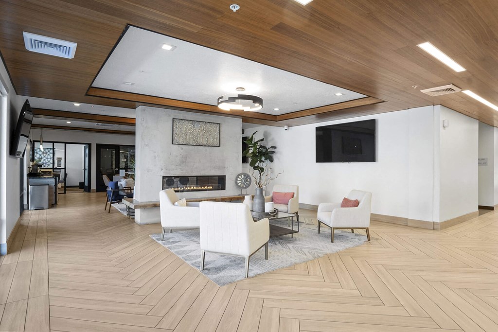 a rendering of a lobby with a fireplace and a tv at The Flats at Riverwoods, Provo, 84604