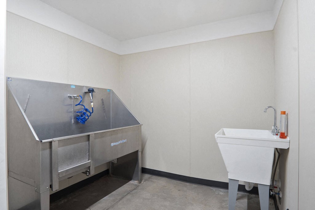 a small room with a sink and a toilet at The Flats at Riverwoods, Provo, Utah