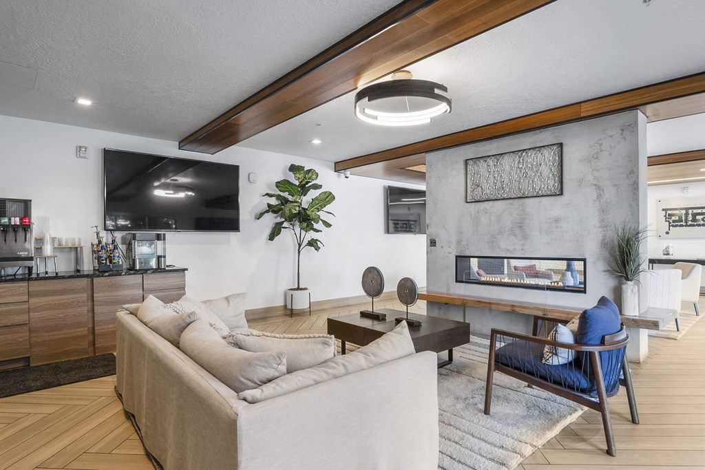 a living room with a couch and a fireplace