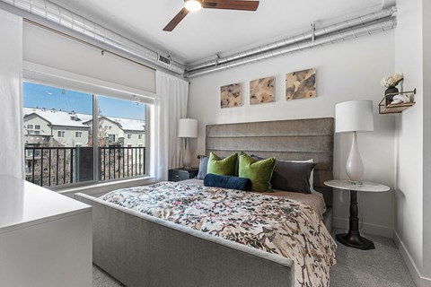 a bedroom with a bed and a window at The Revival, Salt Lake City Utah