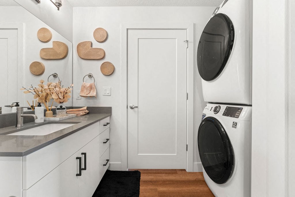 a white laundry room with a washing machine and a sink at The Revival, Salt Lake City, UT 84101