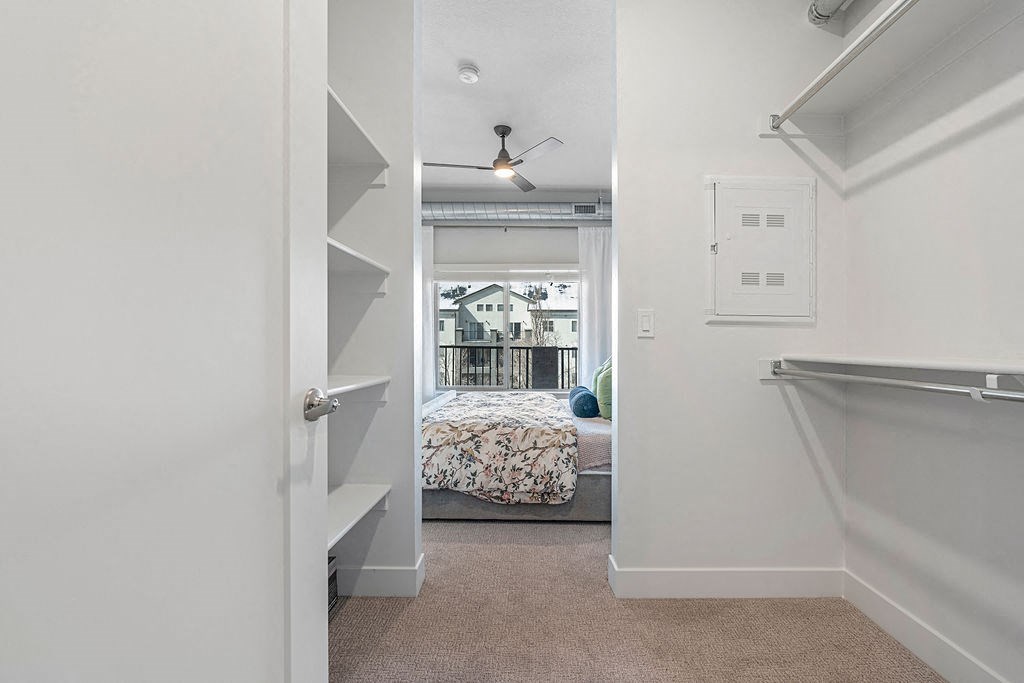 a bedroom with a bed and a closet at The Revival, Utah, 84101