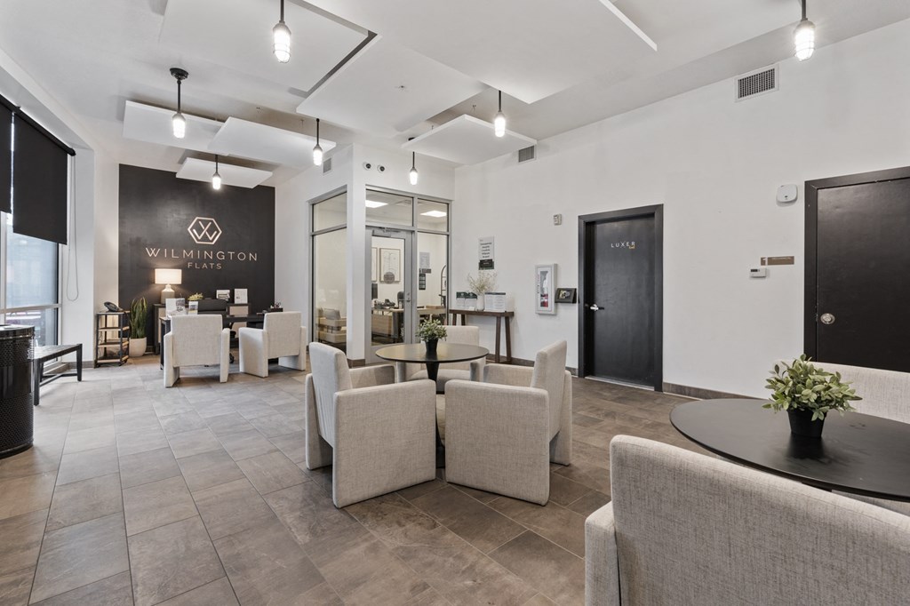 A modern waiting room with a black and white color scheme at Wilmington Flats Apartments, Salt Lake City, Utah