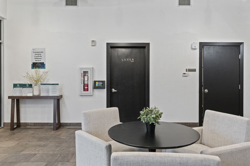 A black door with the word Luxe on it is in a white room at Wilmington Flats Apartments, Salt Lake City, UT, 84106