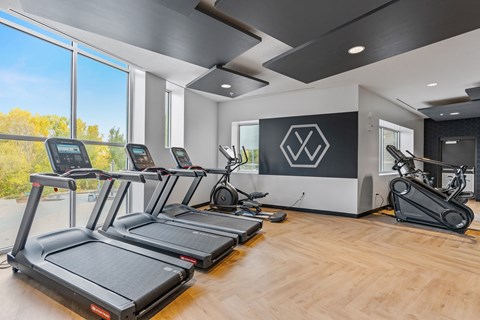 A gym with treadmills and elliptical machines. at Wilmington Flats Apartments, Salt Lake City, 84106