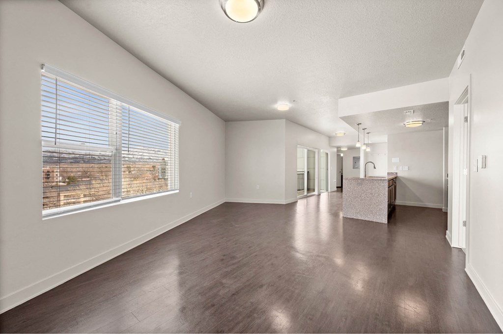 a spacious living room with a large window at Wilmington Flats Apartments, Salt Lake City, 84106