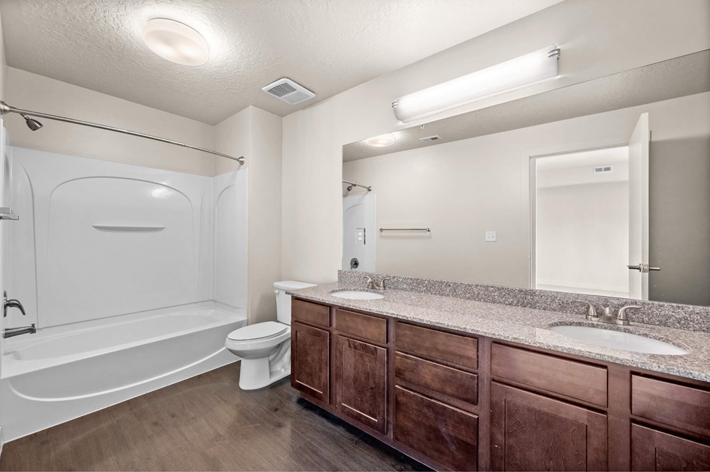 a bathroom with a toilet sink and bathtub at Wilmington Flats Apartments, Salt Lake City