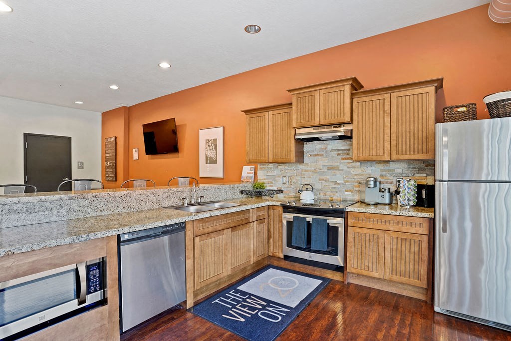 the kitchen has granite countertops and stainless steel appliances at The View on 20th, Ogden, UT, 84401