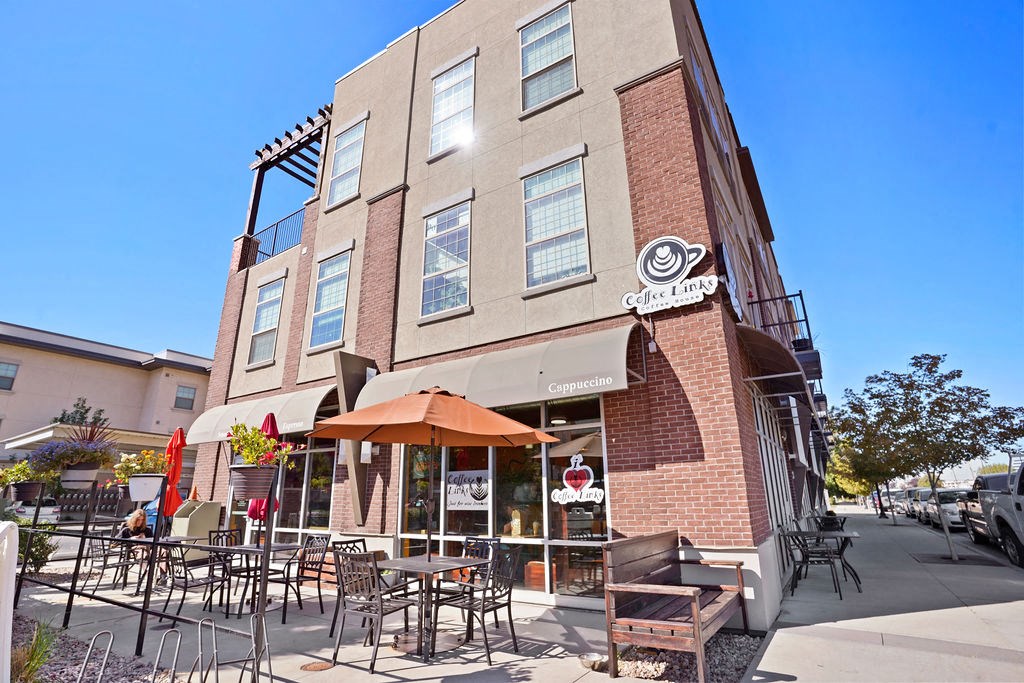 a brick building with tables outside of it at The View on 20th, Ogden, Utah