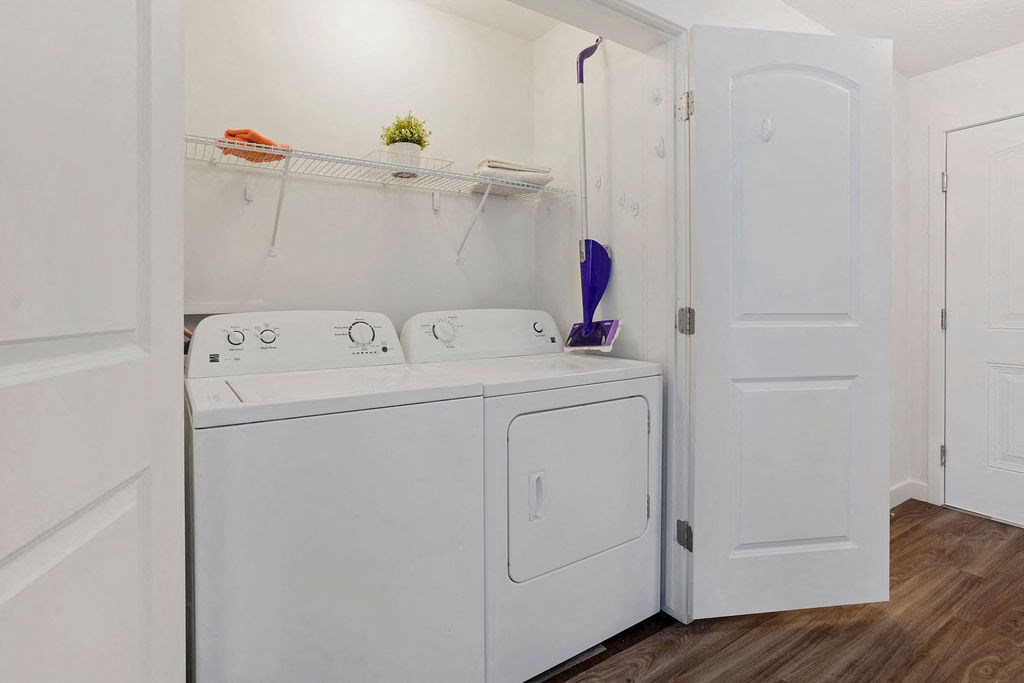 a white washer and dryer in a white laundry room at The View on 20th, Ogden, Utah