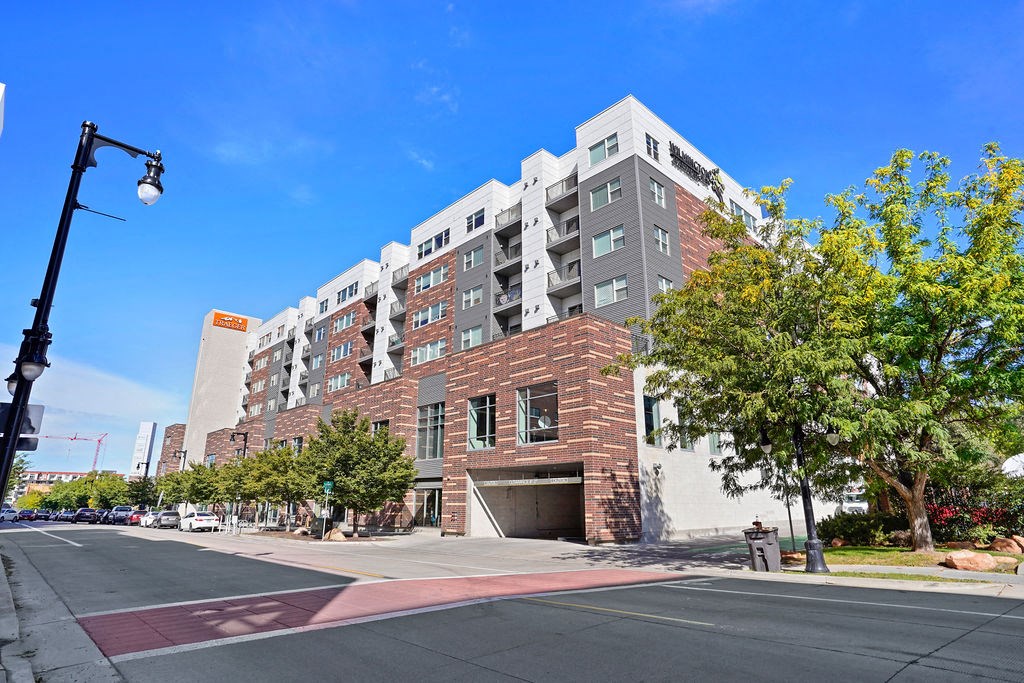 a large brick building with a garage in front of it at Wilmington Flats Apartments, Salt Lake City, UT, 84106