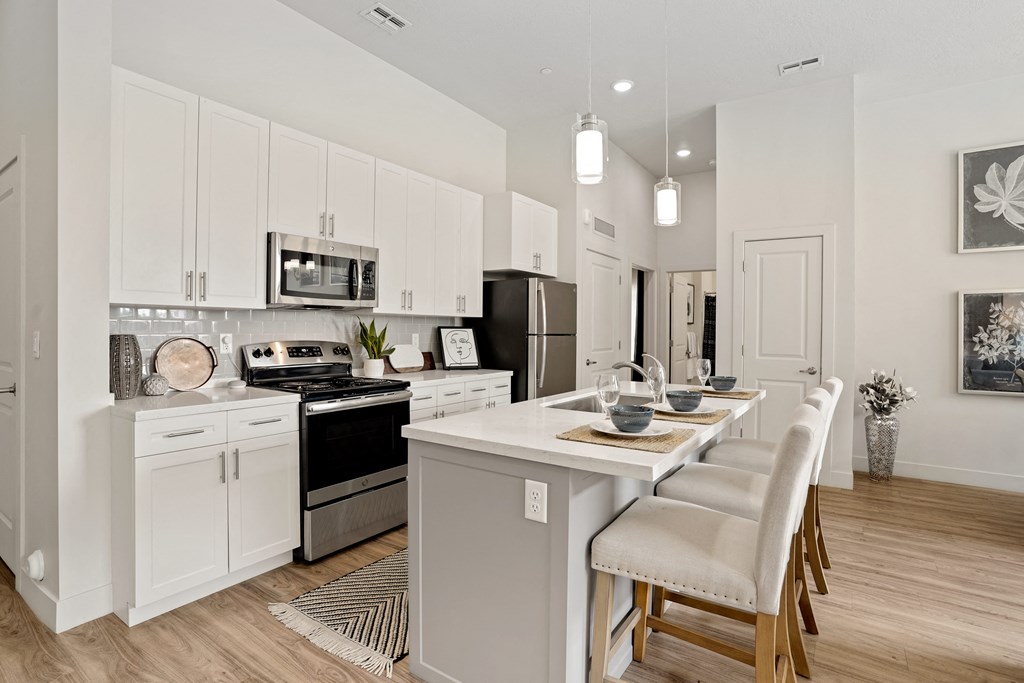 an open kitchen and dining area with a table and chairs at 200 City View, Provo, UT, 84601