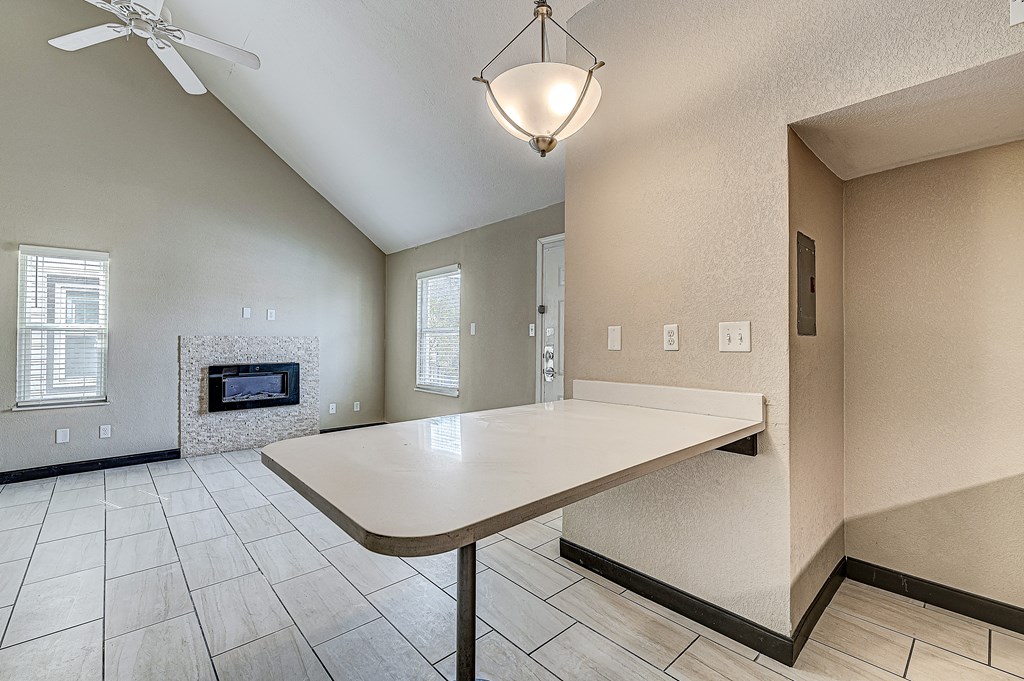 af two story fire place and dining two story