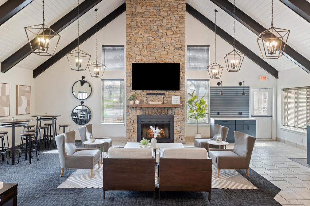 a living room filled with furniture and a fire place