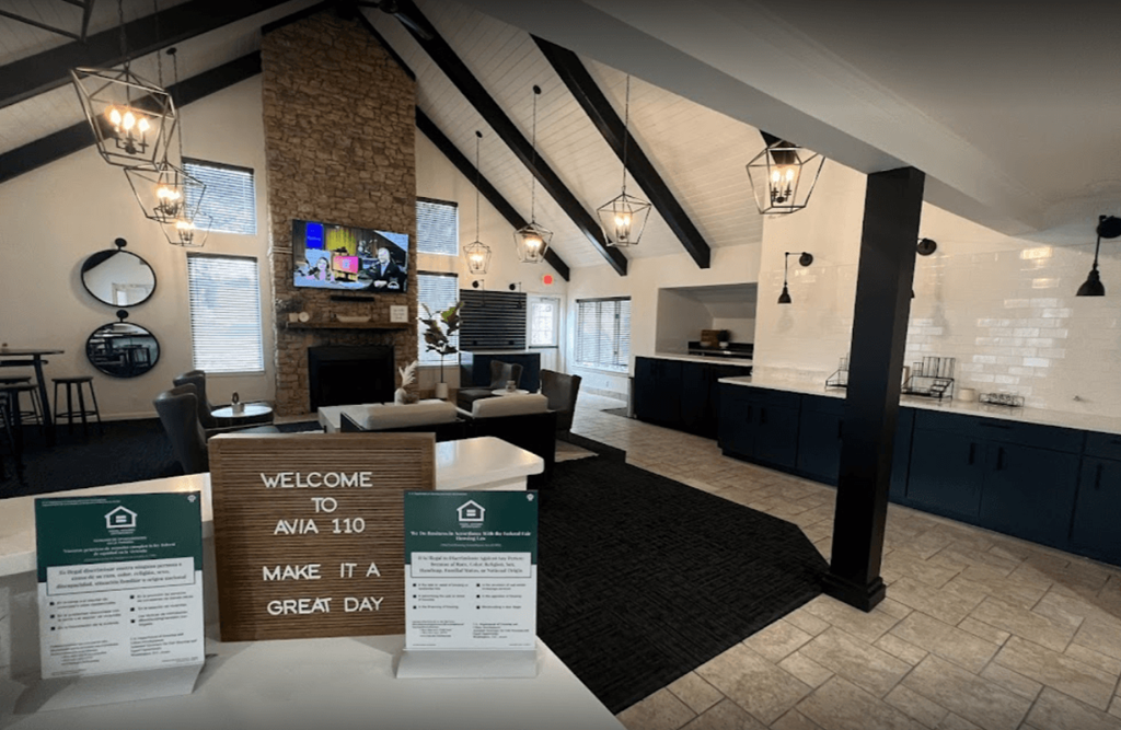 a lobby with a sign that says welcome to make a great day