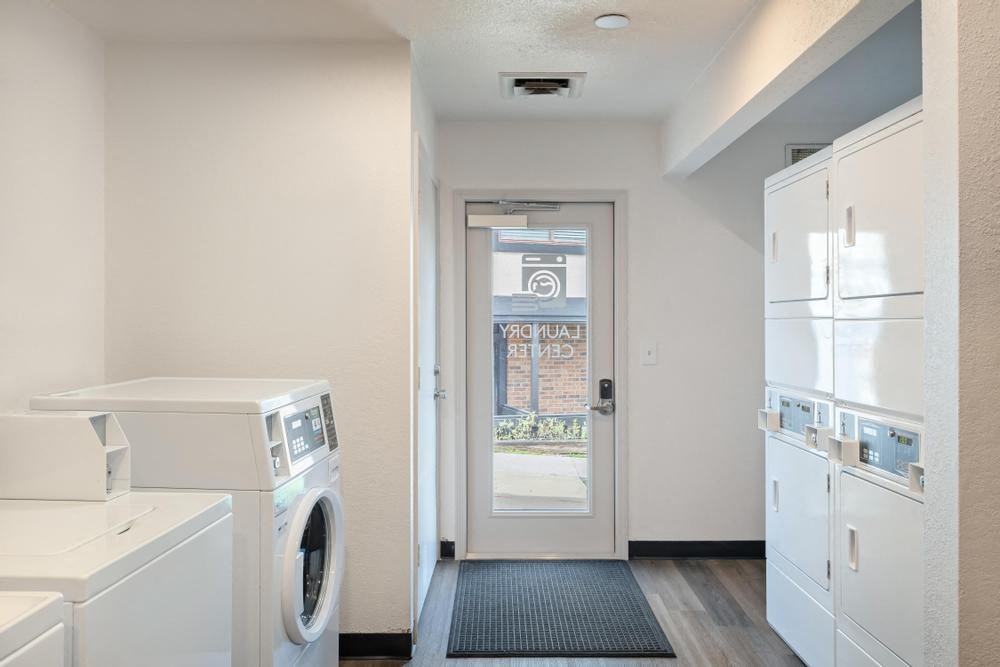 a laundry room with a washer and dryer