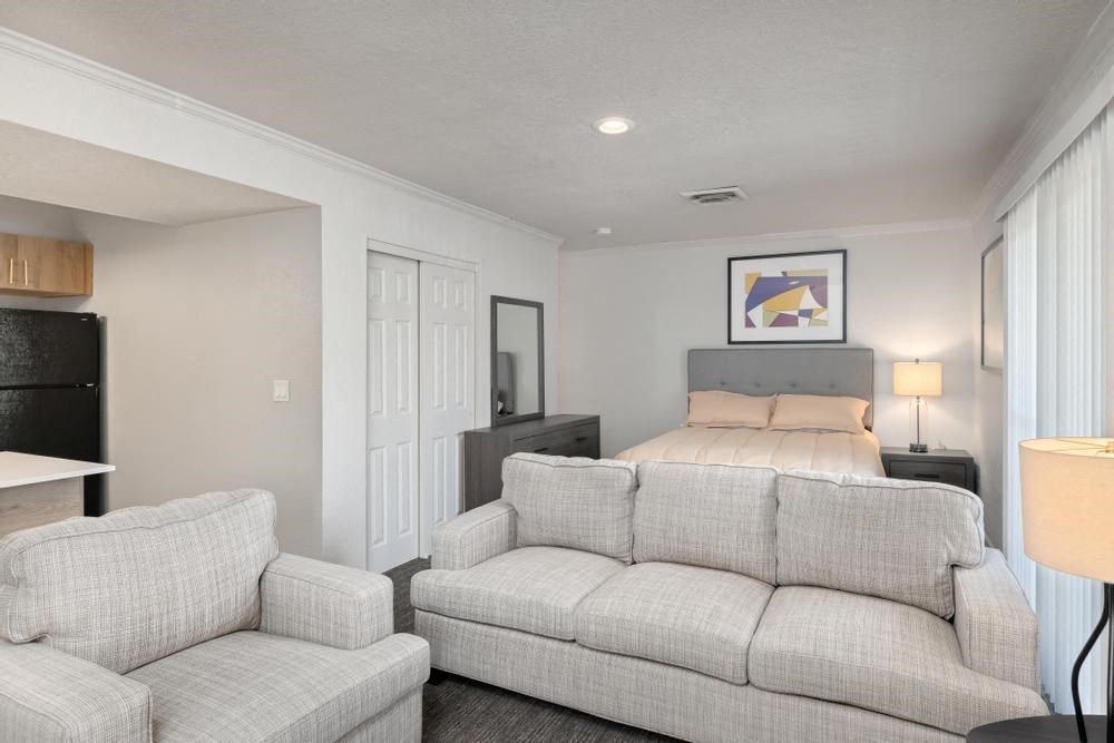 a living room with a couch and a chair