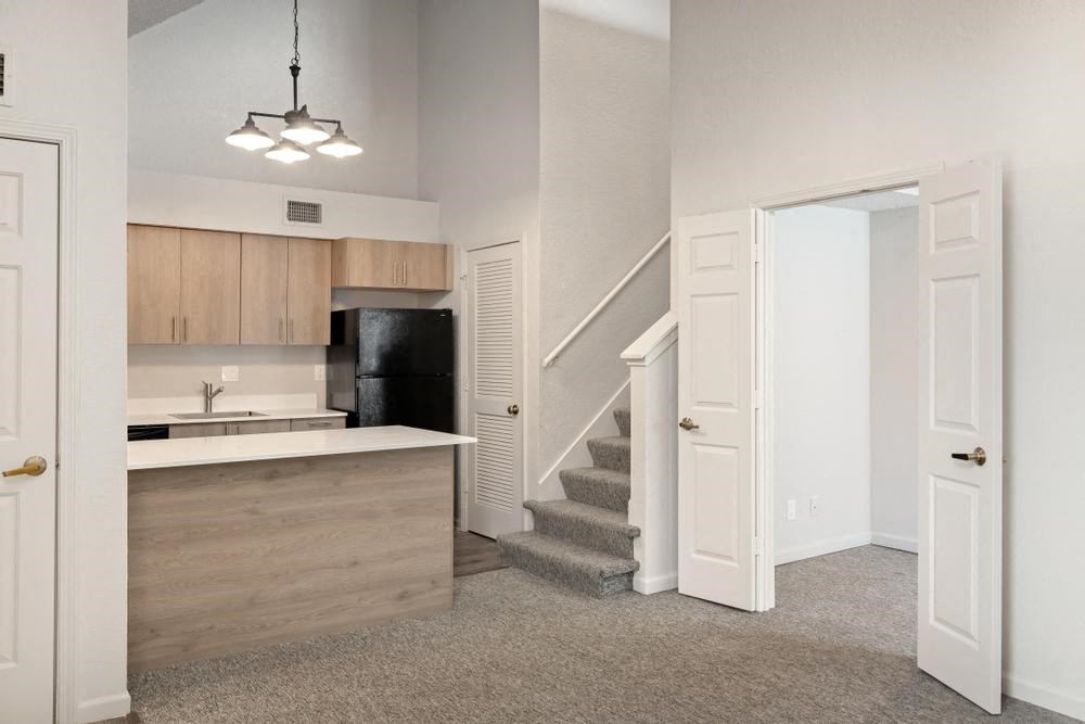 a kitchen and stairs in a house