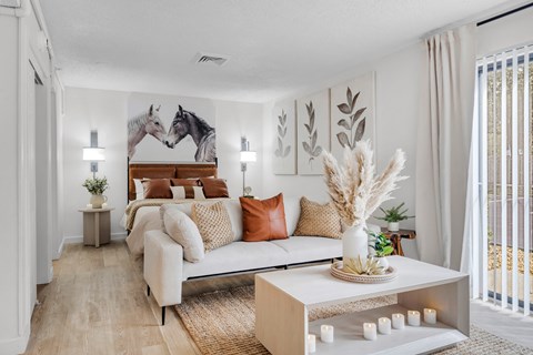 a living room with a couch and a bed