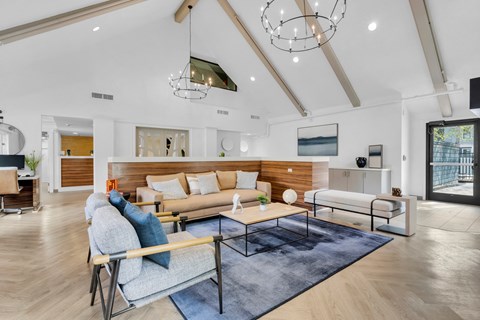 a living room with couches and a coffee table at AVIA Lofts on Liberty Ridge, Jacksonville, FL, 32256