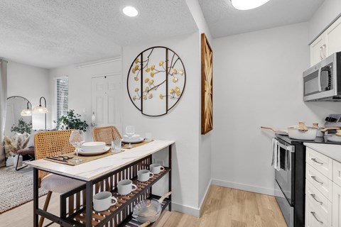 our spacious kitchen and dining room are open to the living room and family room at AVIA Lofts on Liberty Ridge Apartments, Jacksonville, Florida