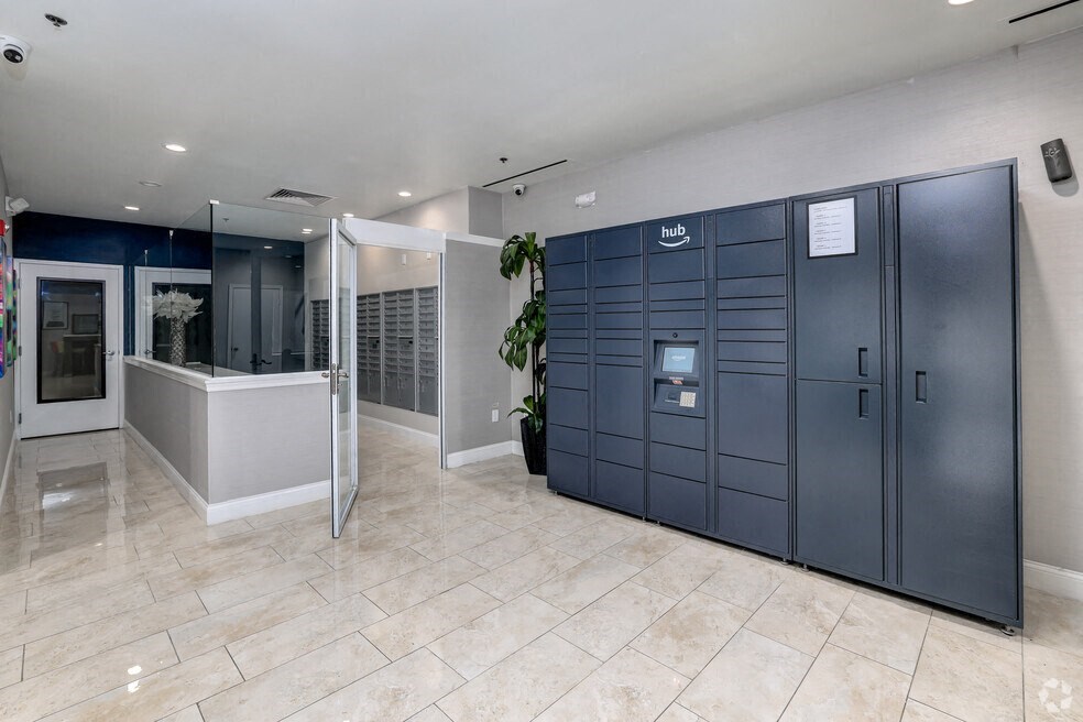 the lobby of a building with two lockers and a tub