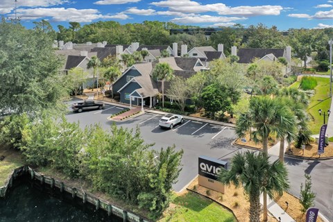 an aerial view of a neighborhood with houses and a parking lot at AVIA Lofts on Liberty Ridge Apartments, Jacksonville