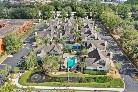 an aerial view of a neighborhood with houses and a swimming pool at AVIA Lofts on Liberty Ridge Apartments, Jacksonville 32256