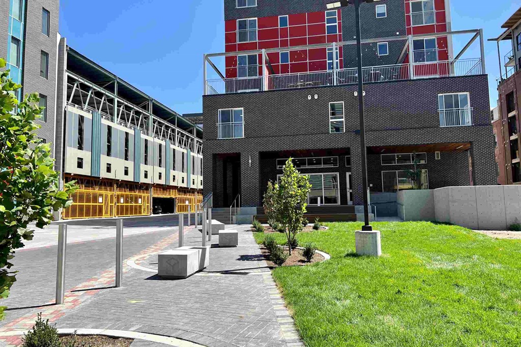 view of a building with a sidewalk and grass at Paperbox Lofts, Salt Lake City, UT