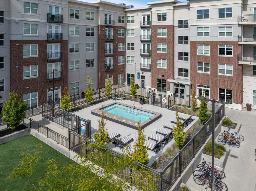 an aerial view of a swimming pool in front of an apartment building at 200 City View, Utah