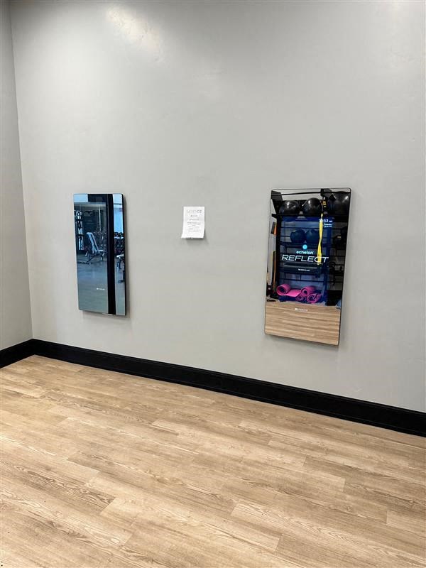 a sign is on the wall next to two machines at SevenO2 Main Apartments, Salt Lake City, 84101