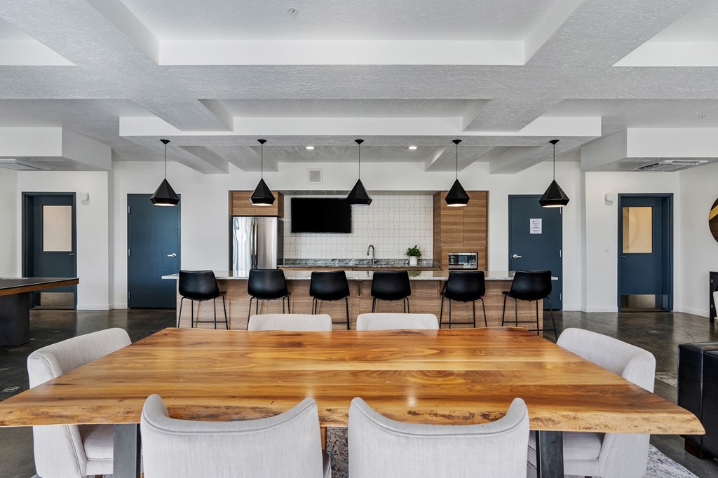 a large dining room with a large table and chairs a large dining room with a large table and chairs at The Flats at Riverwoods, Provo, Utah