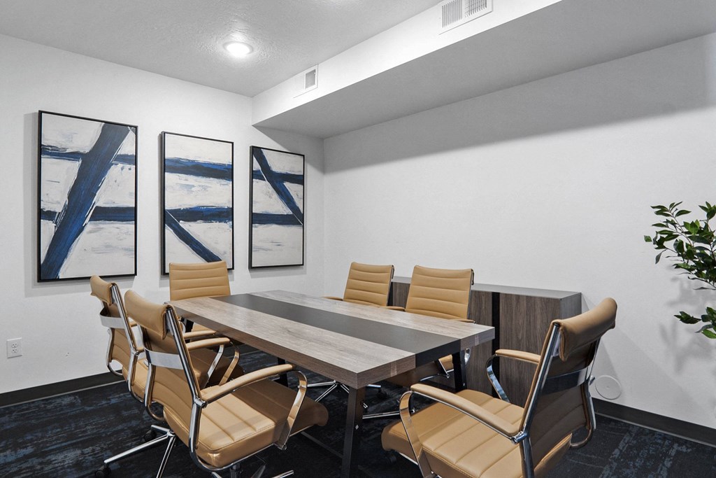 a meeting room with a table and chairs at The Flats at Riverwoods, Provo, UT