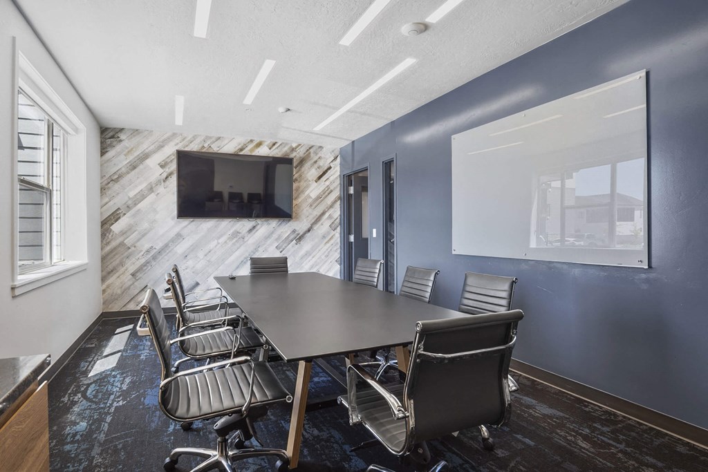 a conference room with a large table and chairs at The Flats at Riverwoods, Provo, 84604