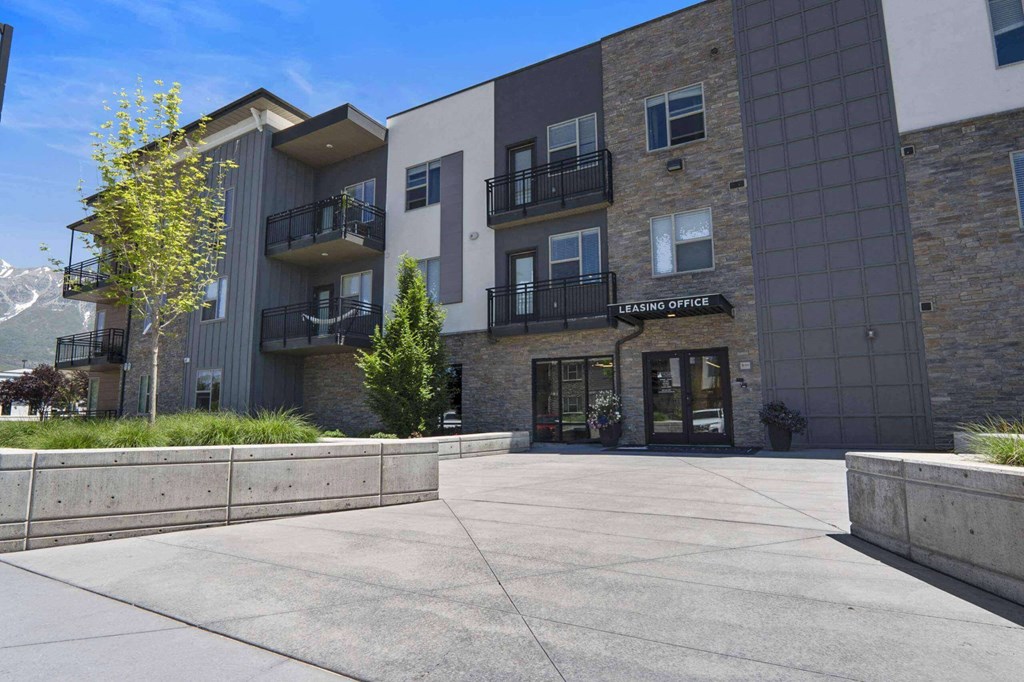 a view of the front of the building at The Flats at Riverwoods, Provo, Utah