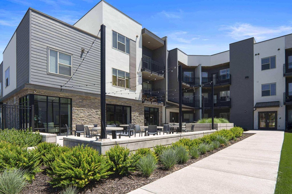 a view of the building from the outside at The Flats at Riverwoods, Provo