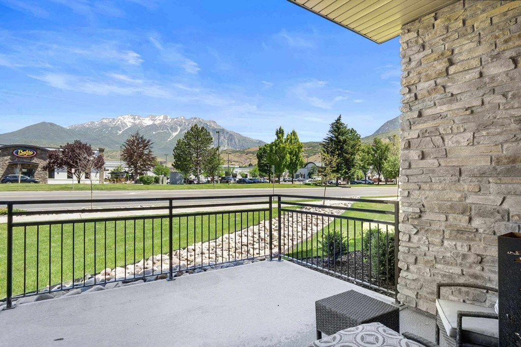 take in the mountain views from the balcony at The Flats at Riverwoods, Provo, UT