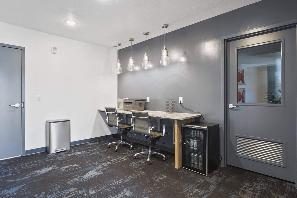 a small conference room with a desk and chairs at The Flats at Riverwoods, Provo, UT