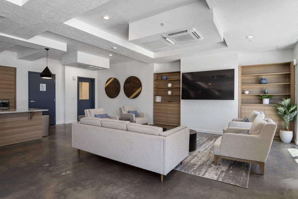 a living room filled with furniture and a flat screen tv at The Flats at Riverwoods, Utah, 84604