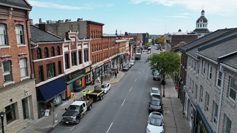 a view of a city street from the top of a building