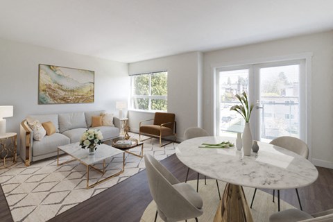 a living room with white walls and hardwood floors