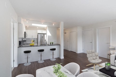 a kitchen and living room in a 555 waverly unit