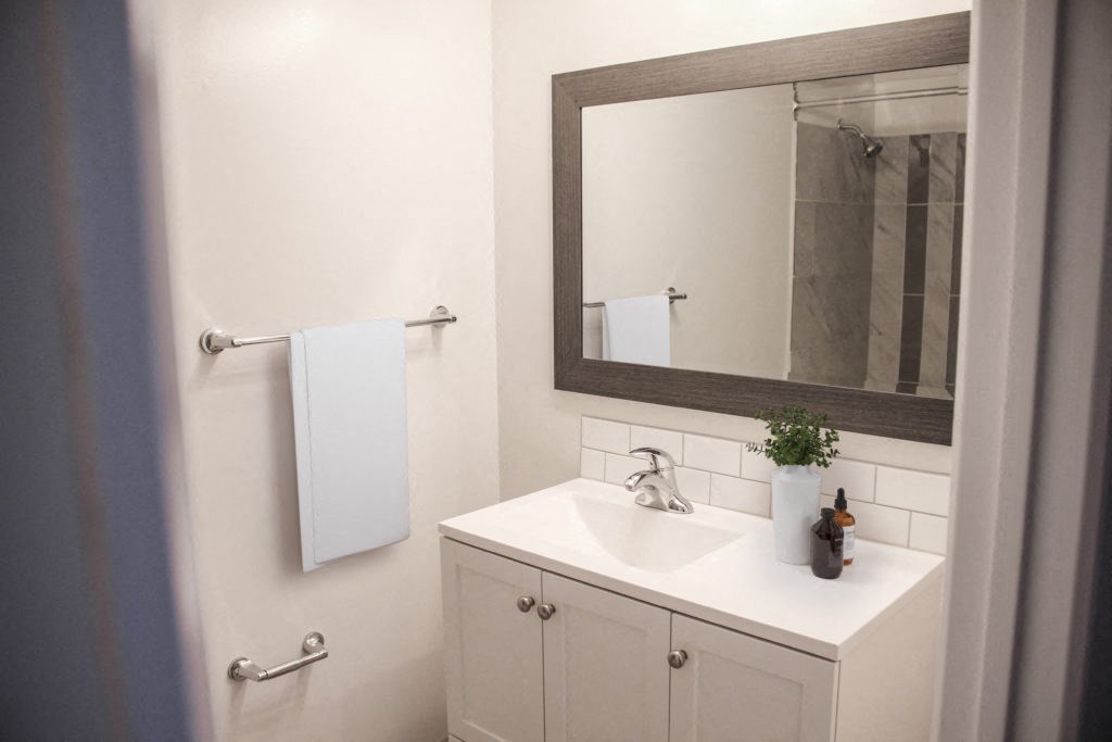 a bathroom with a sink and a mirror