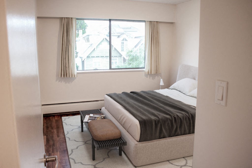 a bedroom with a bed and a window