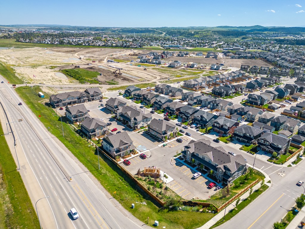 an aerial view of a neighborhood of houses on a street and an intersection